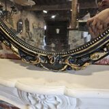Ancien miroir ovale patiné noir et doré style louis xv