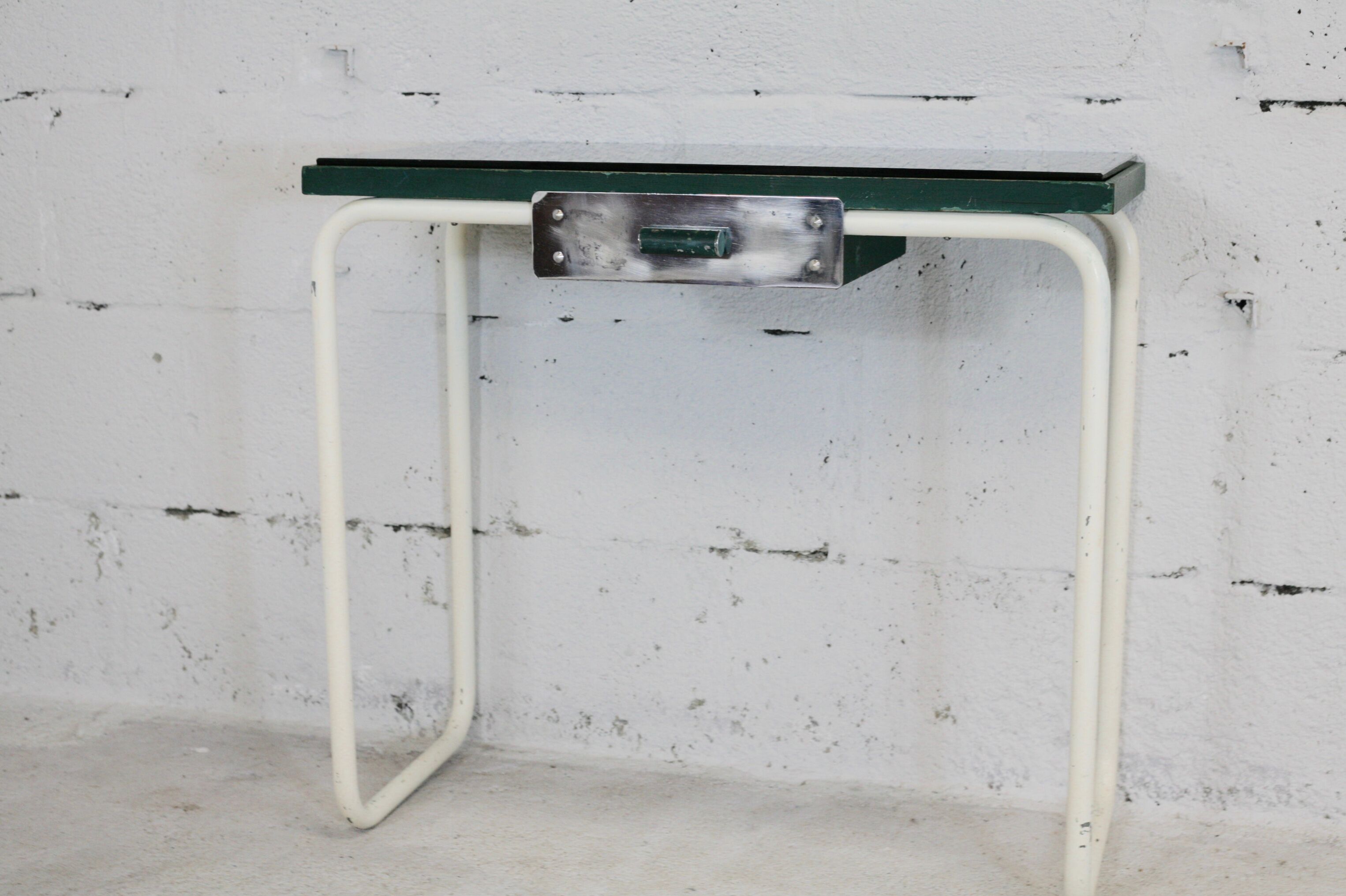 Tubular steel console, black glass tray, circa 1950