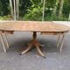 Round extendable dining table Regency central leg stripped mahogany 1960