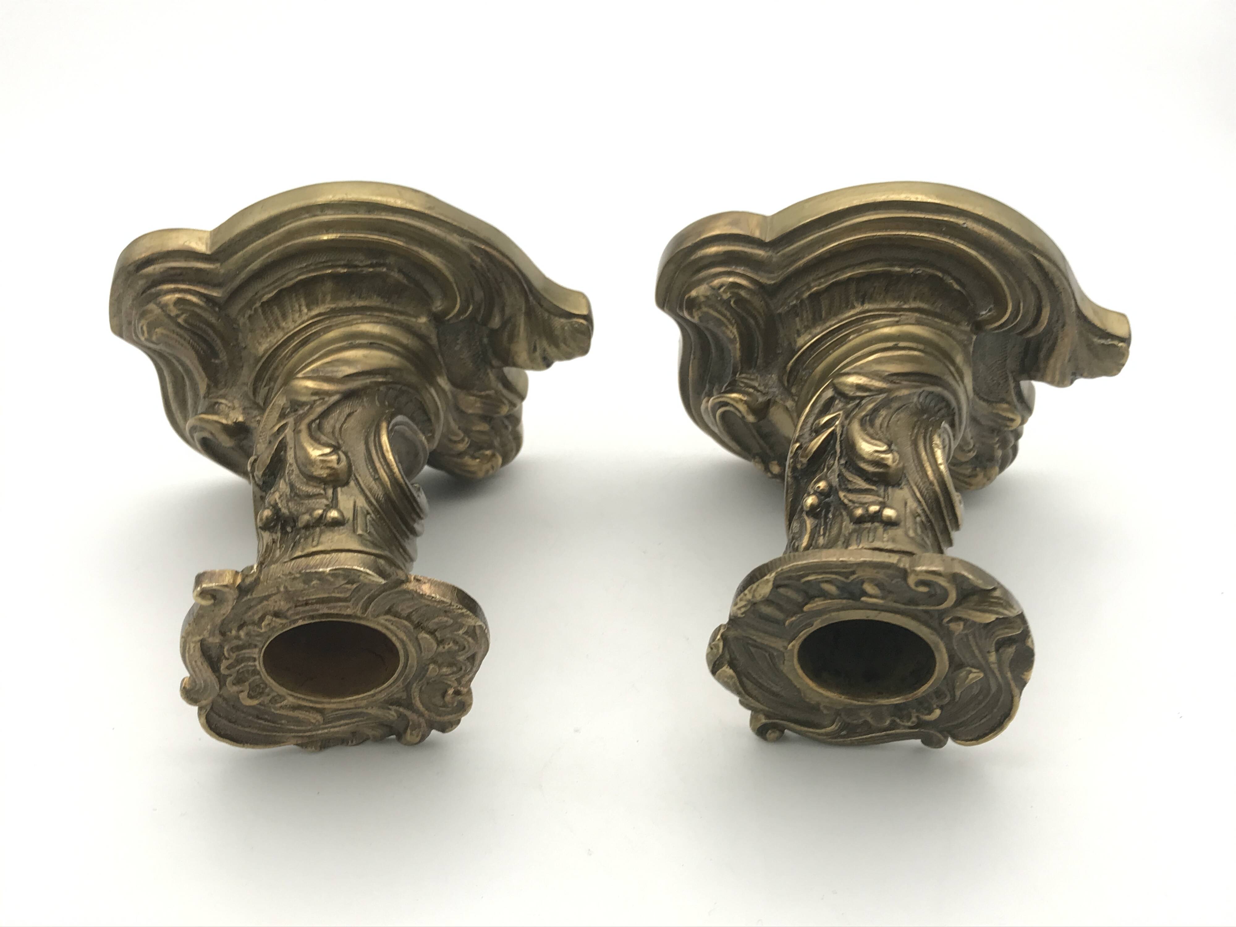 Pair of gilded bronze candlesticks with twisted decor and floral garlands, louis xv style