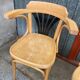 Pair of curved wooden bistro chairs with armrests
