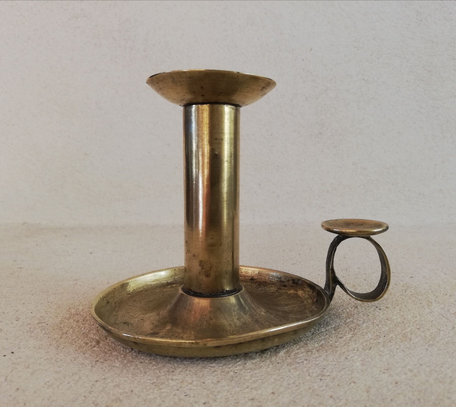 Brass hand candle holder