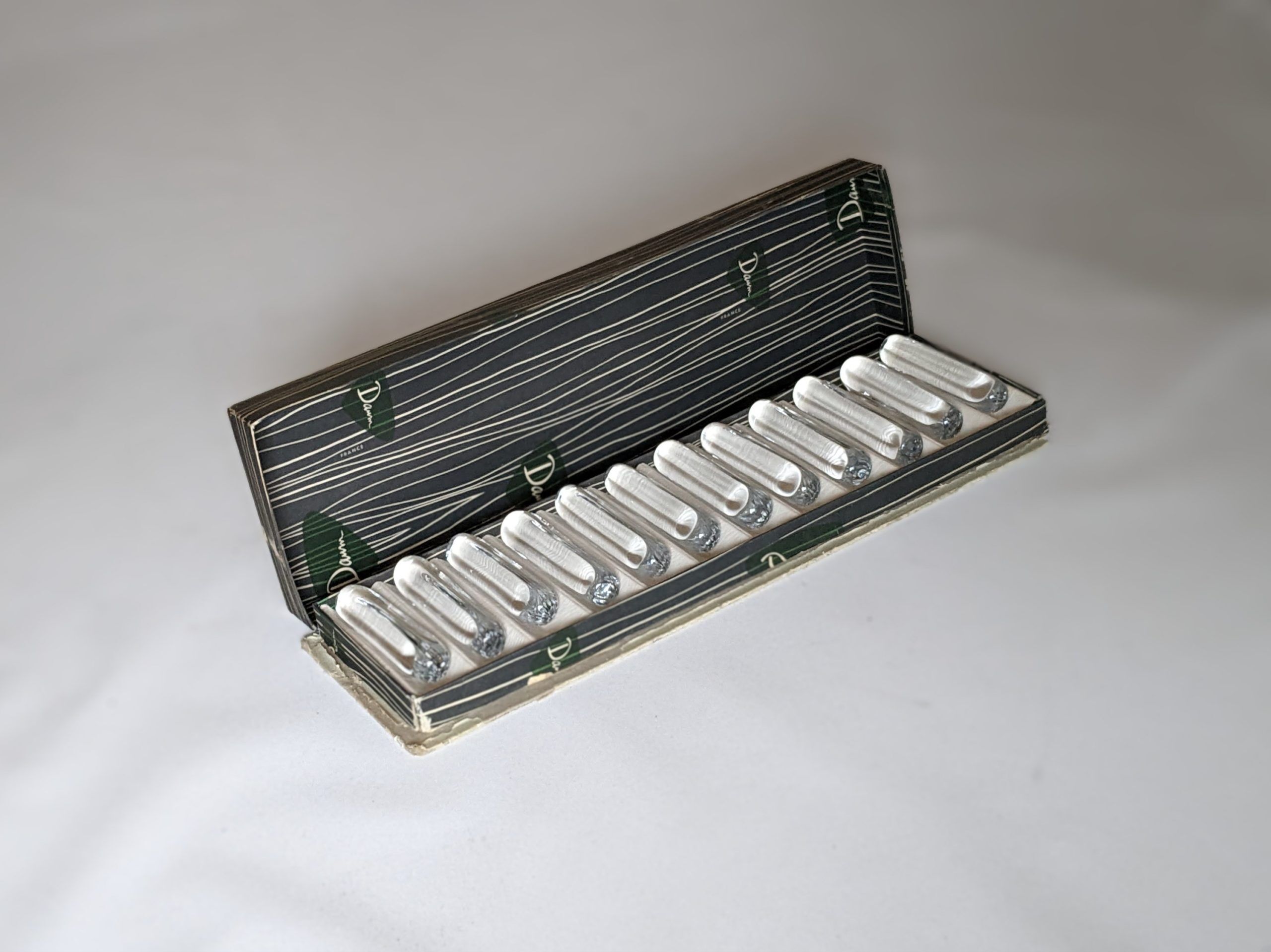 Suite of 12 Daum knife holders