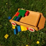 Wooden pull cart with its shapes to build