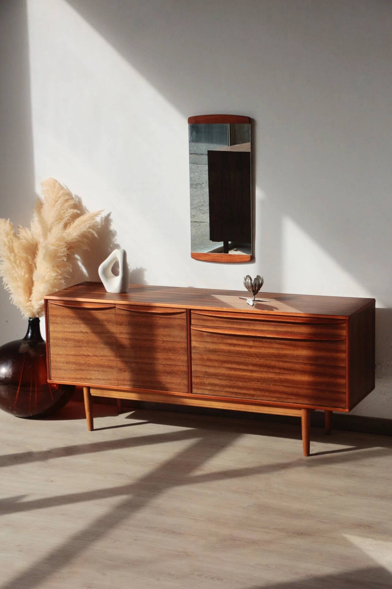 Vintage zebrano and walnut furniture from Morris of Glasgow.