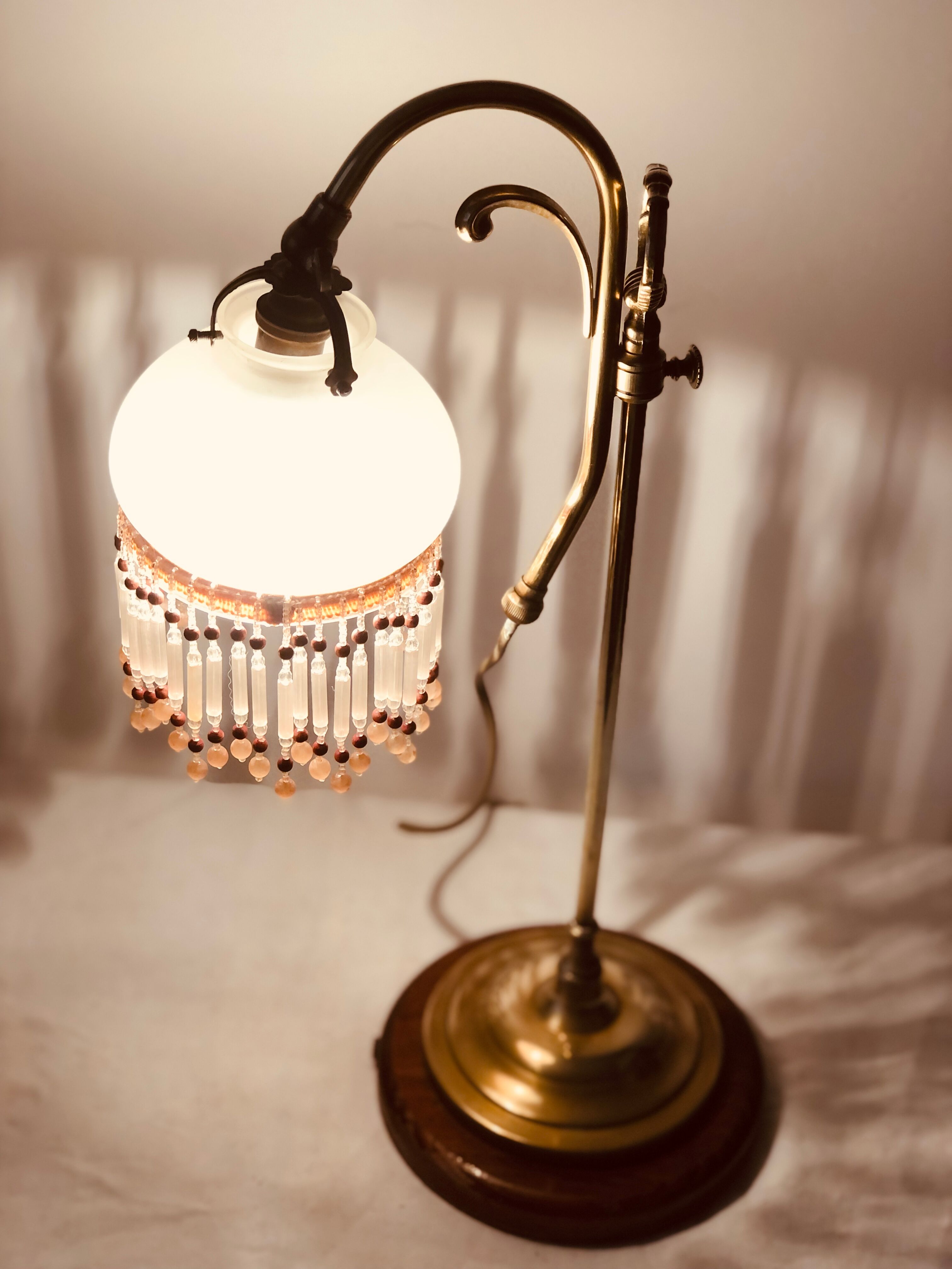 Old lamp adjustable on foot tulip golden brass.