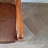 Armchair in woven rattan and exotic wood