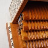 Wood cigarette box and mother-of-pearl inclusion