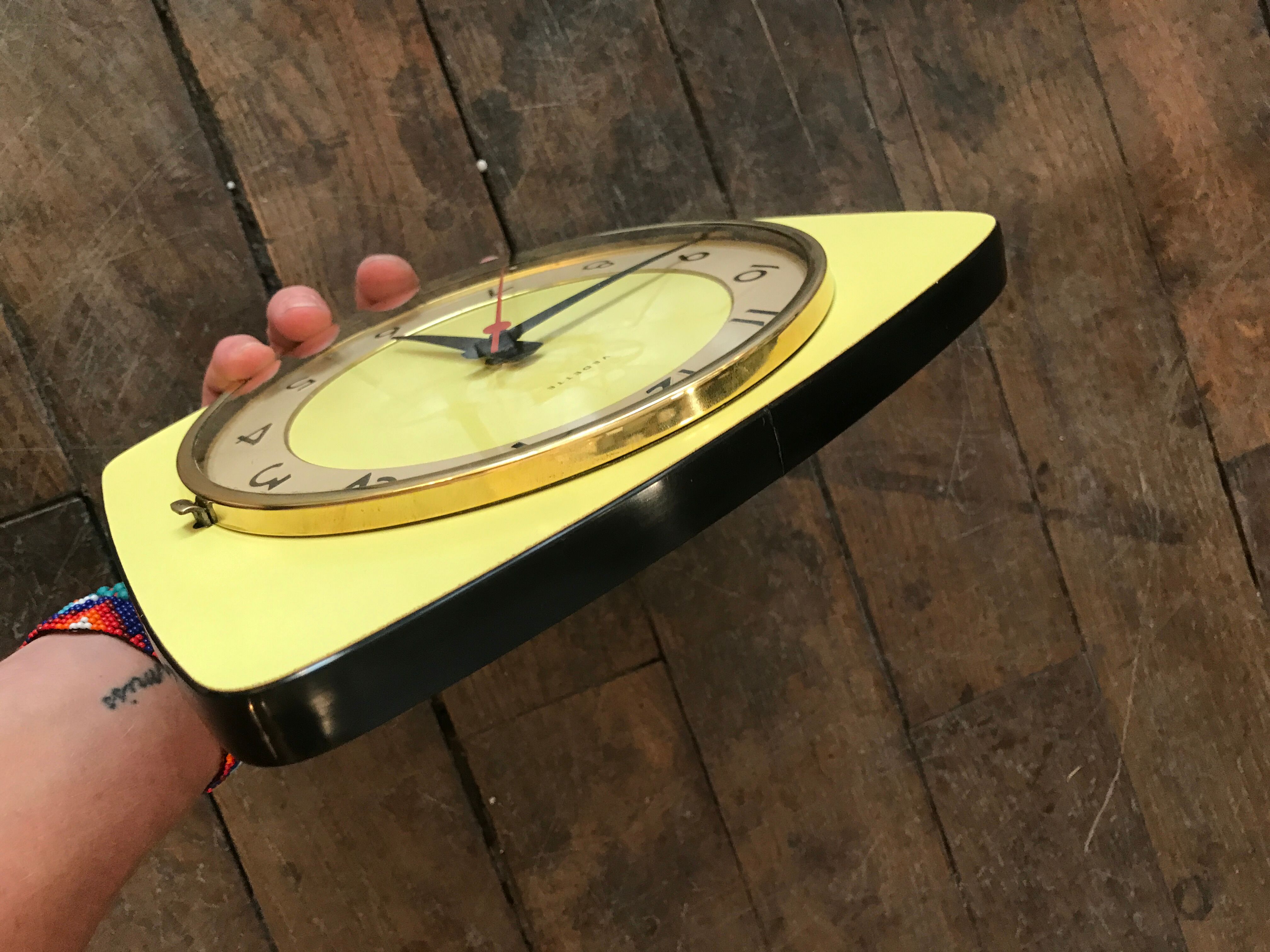 Vintage clock star Formica yellow wall pendulum