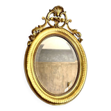 Antique oval mirror from the 20th century