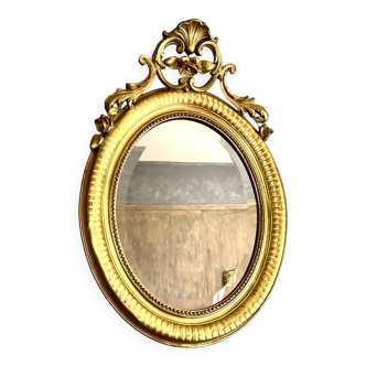 Antique oval mirror from the 20th century