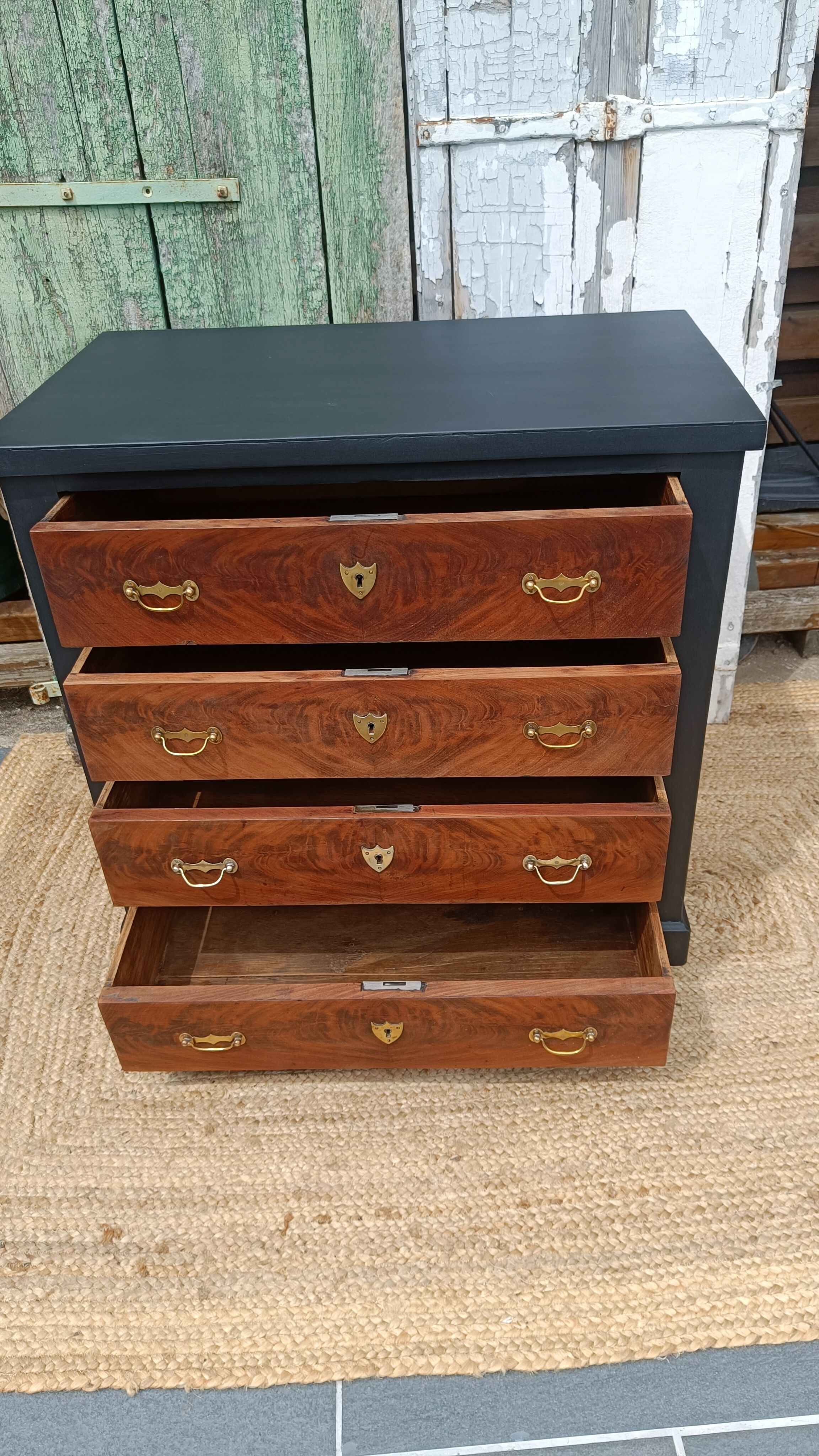 Vintage commode revamped in matte black & wood with warm tones.