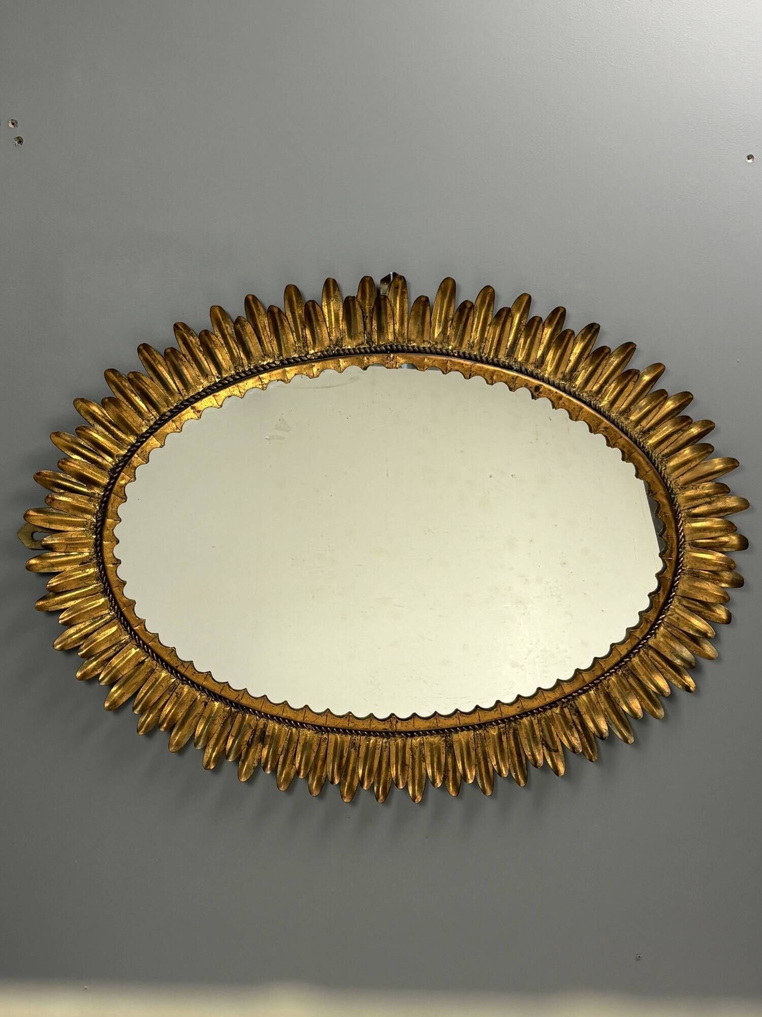 Midcentury bohemian Hollywood Regency Spanish gilt metal sun mirror, 1960s