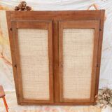Low cabinet in raw wood and woven raffia