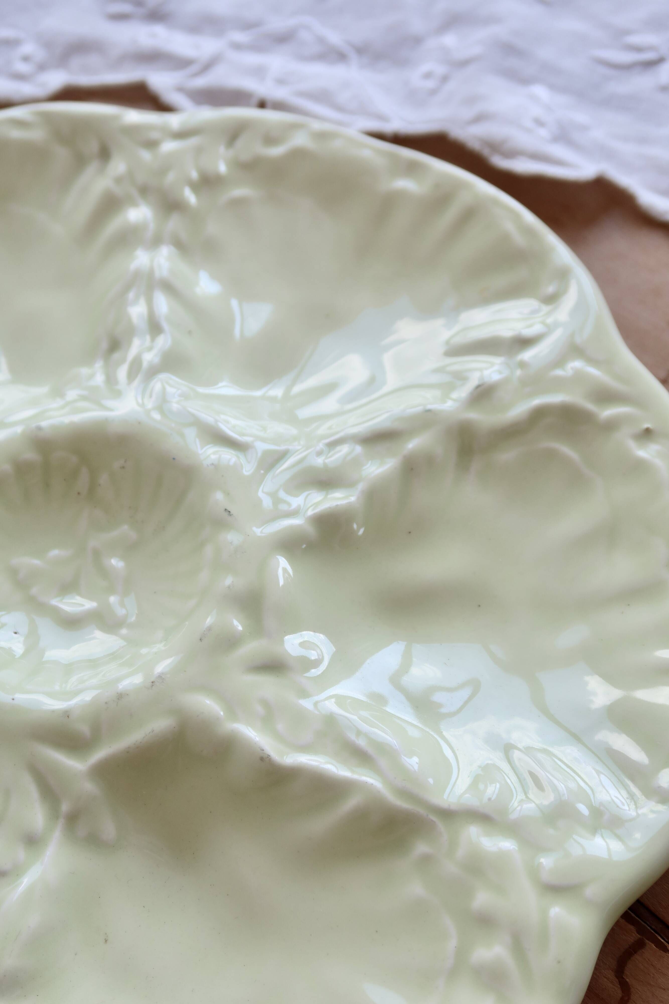 Vintage Gien oyster plate in almond green earthenware.