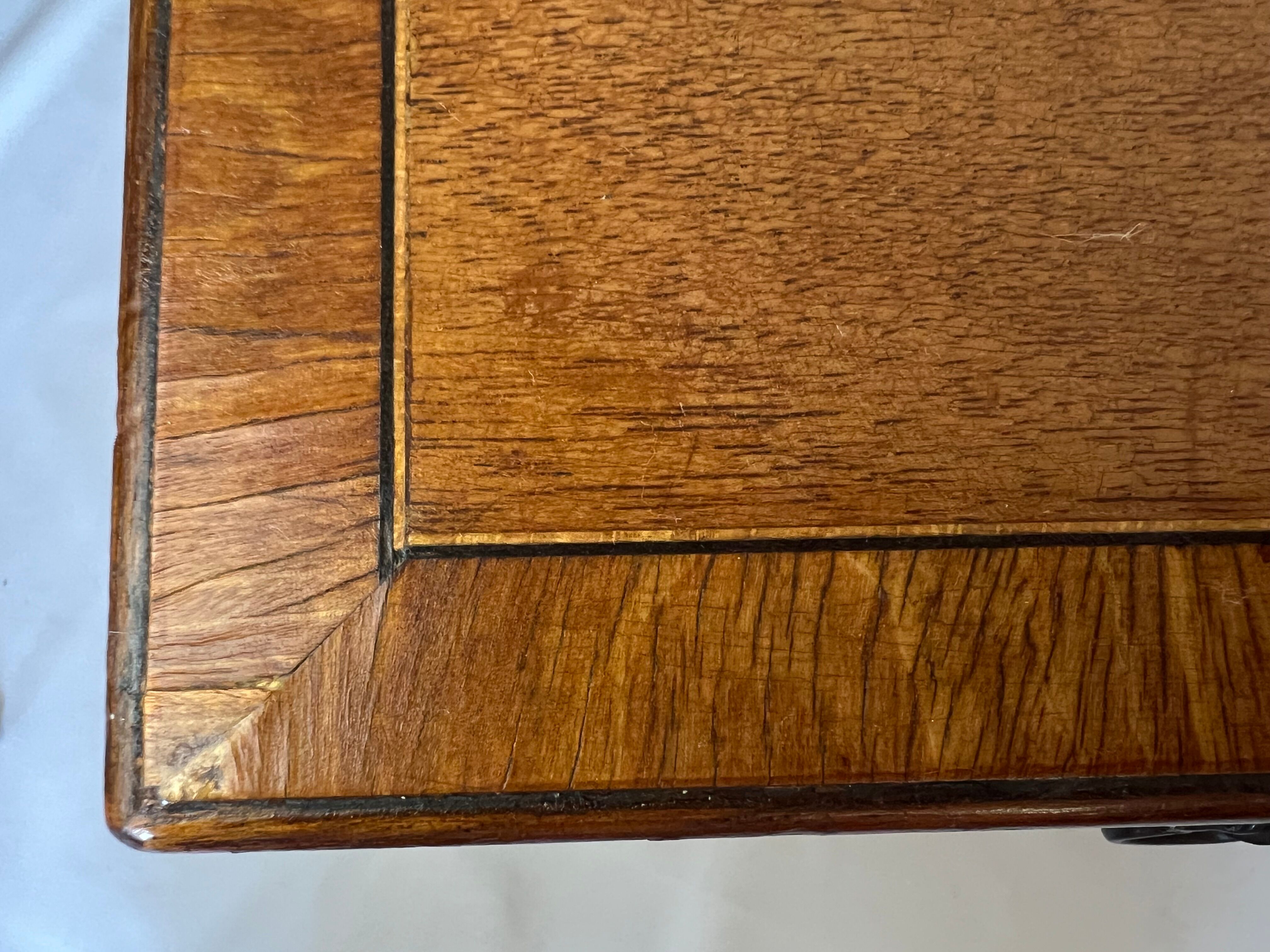 Pair of English mahogany side tables with sliding shelf.