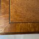 Pair of English mahogany side tables with sliding shelf.