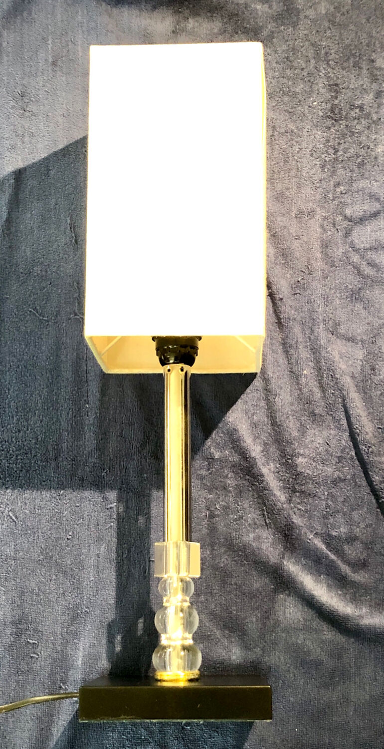 Silver floor lamp with a straight shade.
