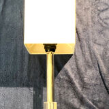 Silver floor lamp with a straight shade.