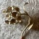 Ecru metal flower wall sconce