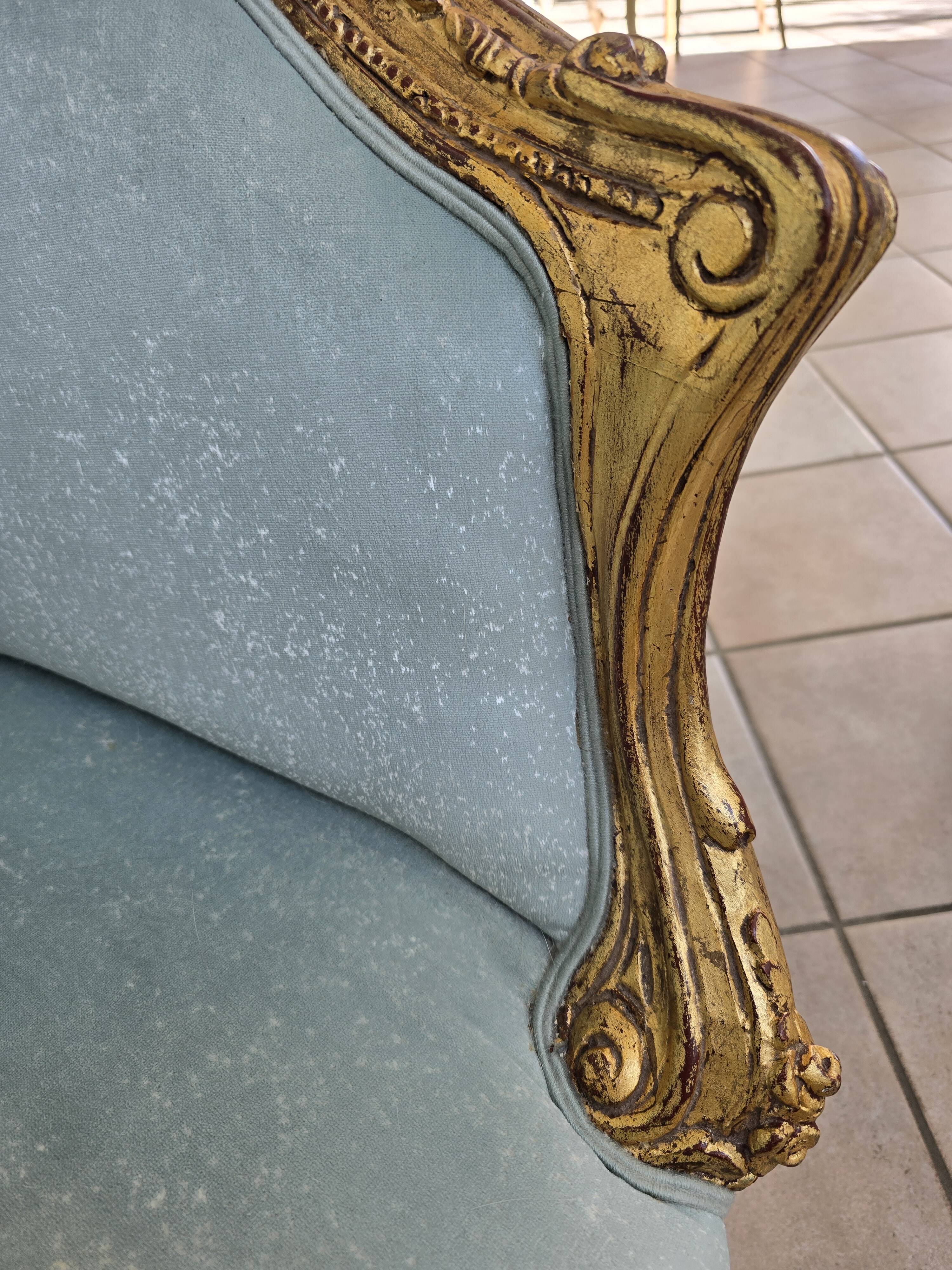 Louis XV gilt basket canapé with green velvet.