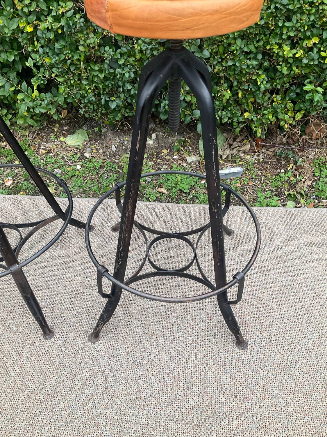 Pair of vintage metal and leather bar stools
