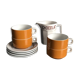 Hot chocolate cups and milk jar