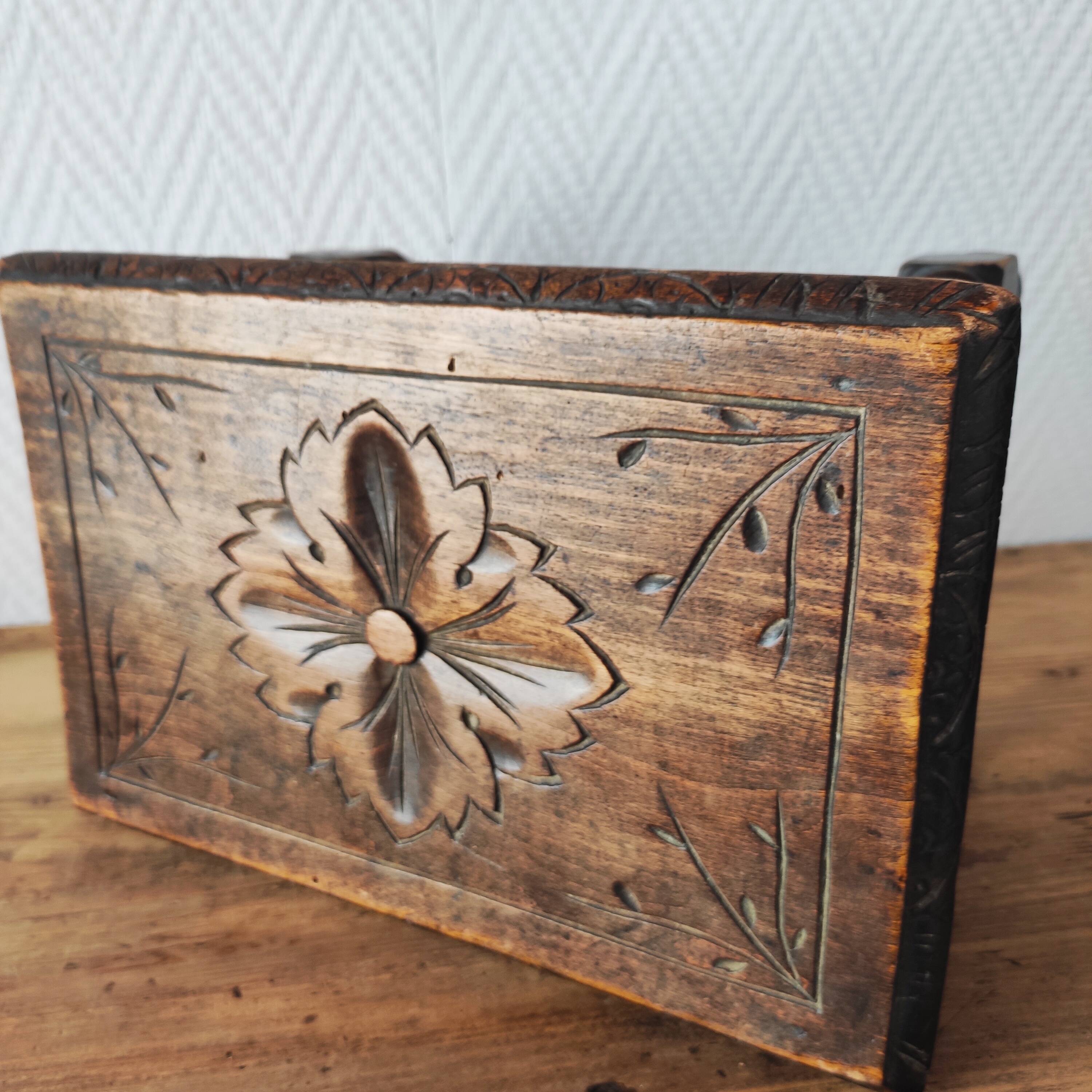 Old carved wooden footrest