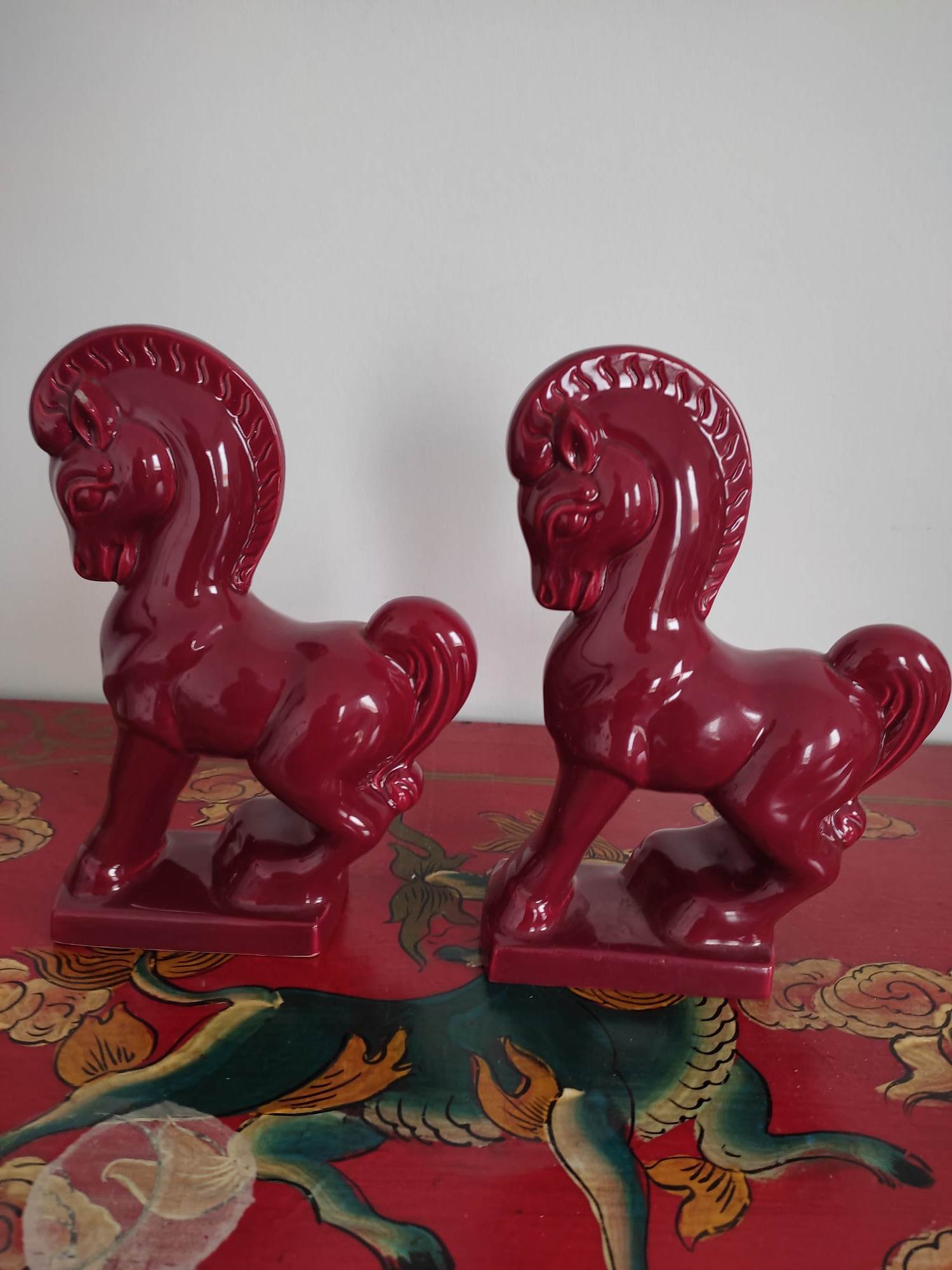 Pair of red porcelain horse bookends