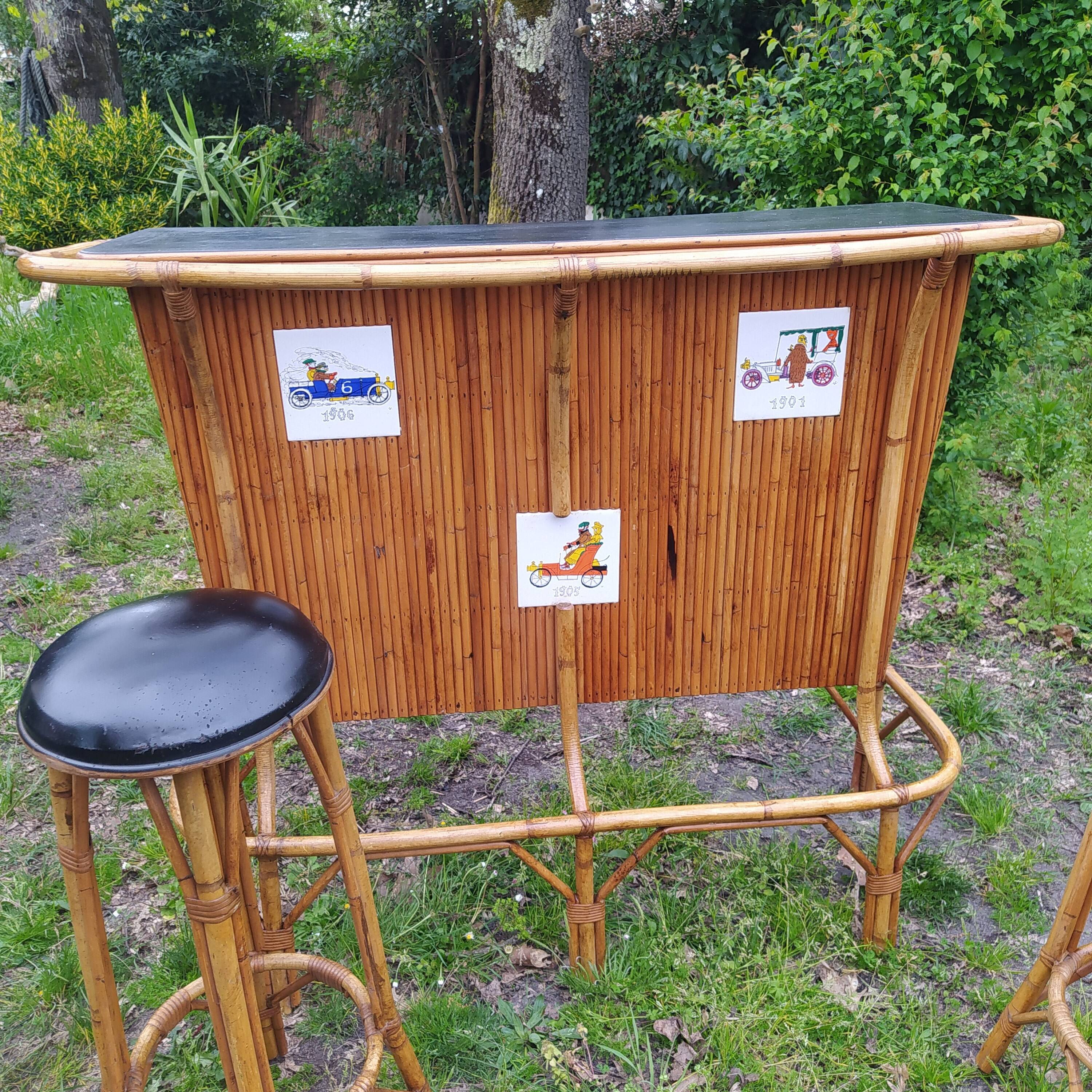 Vintage rattan bar with 1960s earthenware tile decor with 2 stools