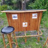 Vintage rattan bar with 1960s earthenware tile decor with 2 stools