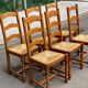 6 solid oak dining chairs with rush seats from the 1980s.