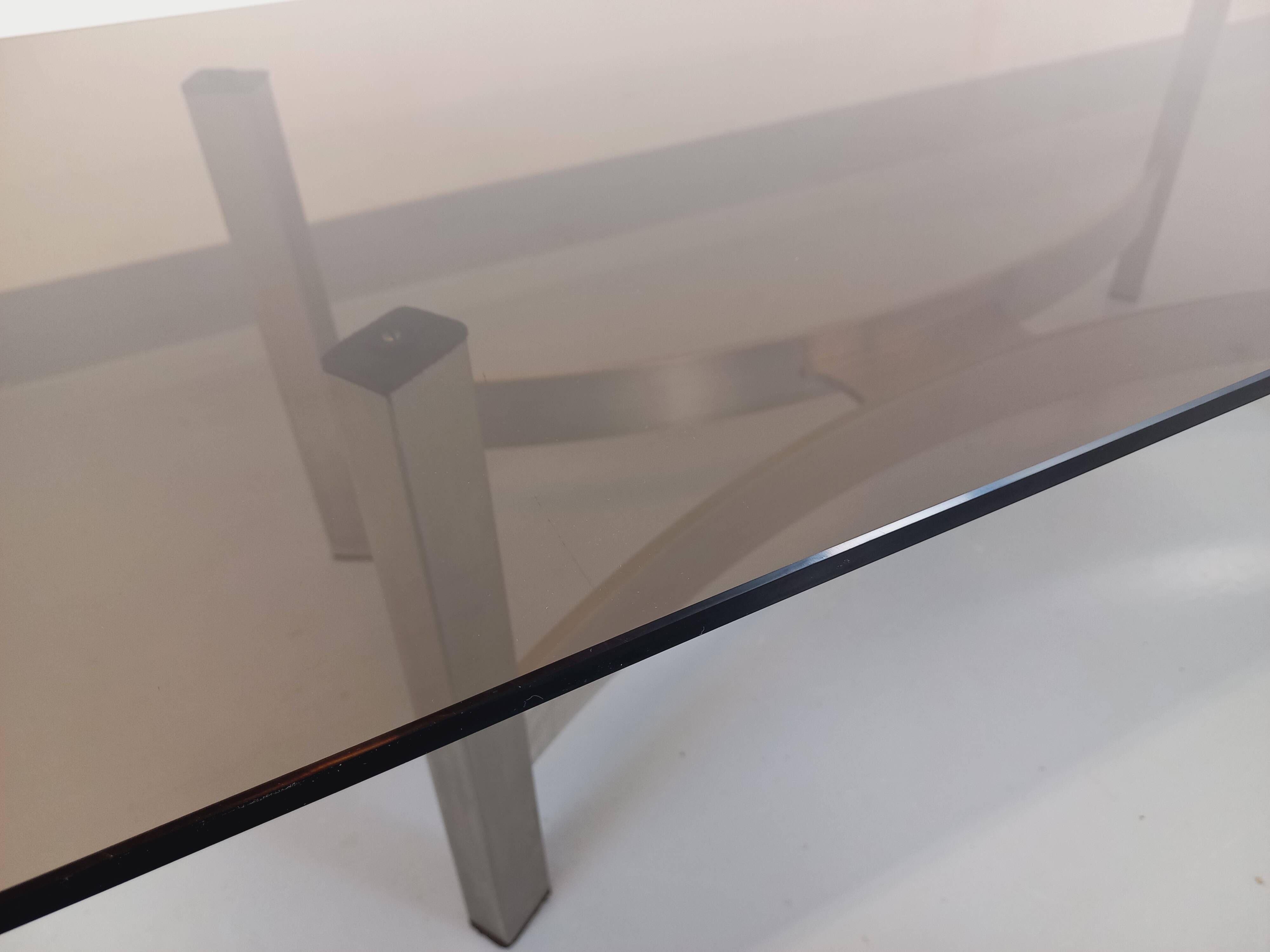 Vintage coffee table in smoked glass and brushed cast aluminum from the 70s