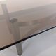 Vintage coffee table in smoked glass and brushed cast aluminum from the 70s