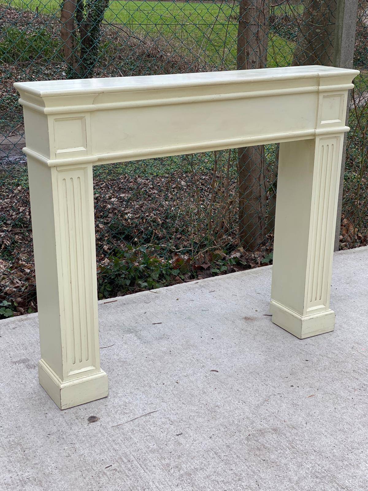 Fireplace surround with beige solid wood mantel