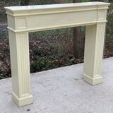 Fireplace surround with beige solid wood mantel