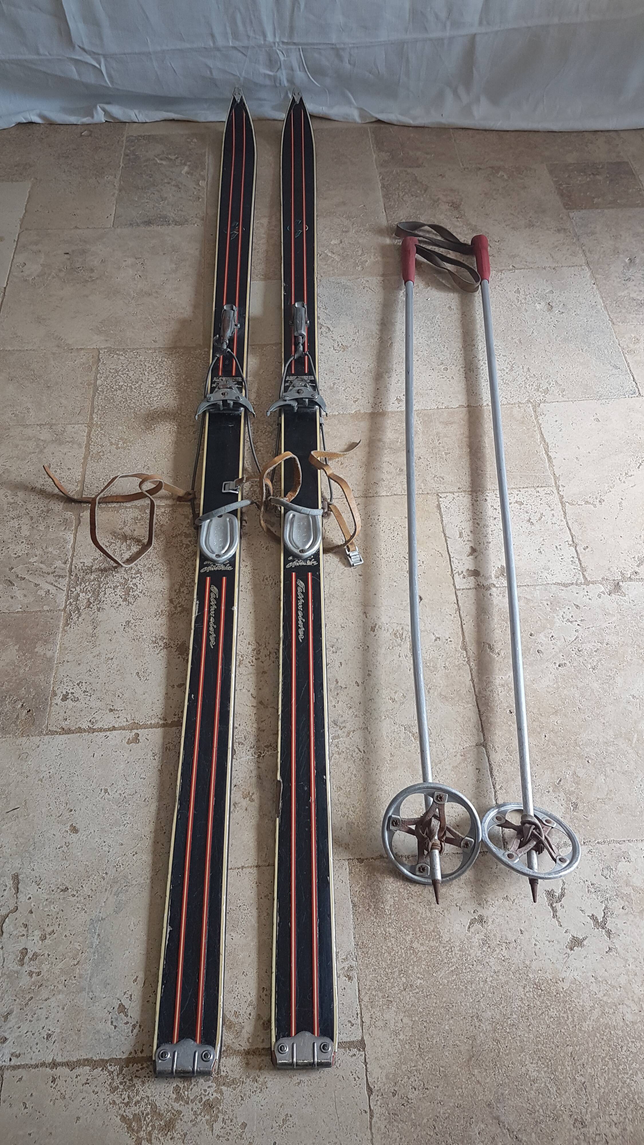 Old skis wooden and its pair of sticks