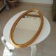 Miroir vintage ovale en bois doré années 60 77*41 cm