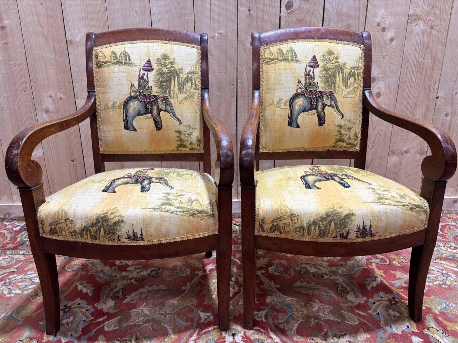 Pair of 19th-century armchairs with a scrolled back