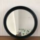 Vintage round mirror in black gilac plastic