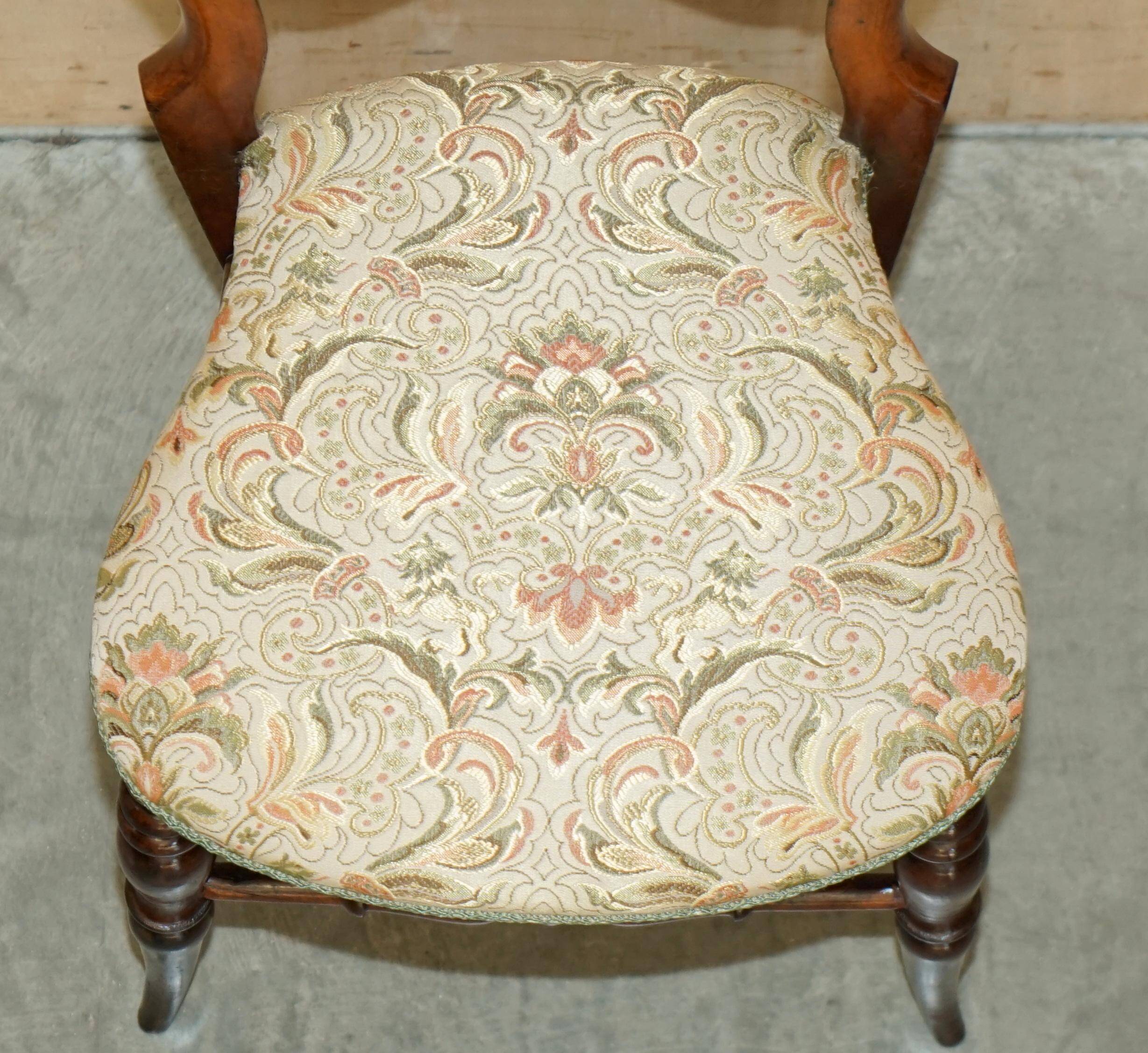 Victorian walnut dressing table chair from around 1880 with a medallion on the backrest.