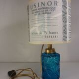 Table lamp with king blue and gold glass foot and machineinor action lampshade