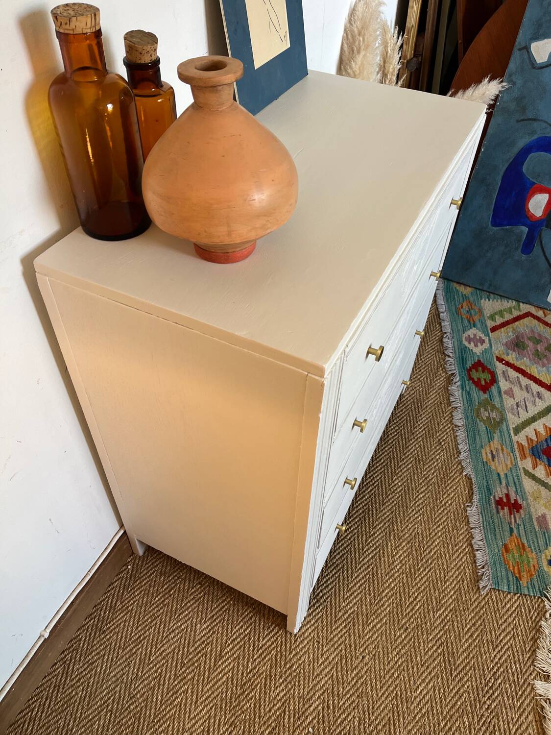 Restored wooden art deco chest of drawers with gilded handles