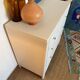 Restored wooden art deco chest of drawers with gilded handles