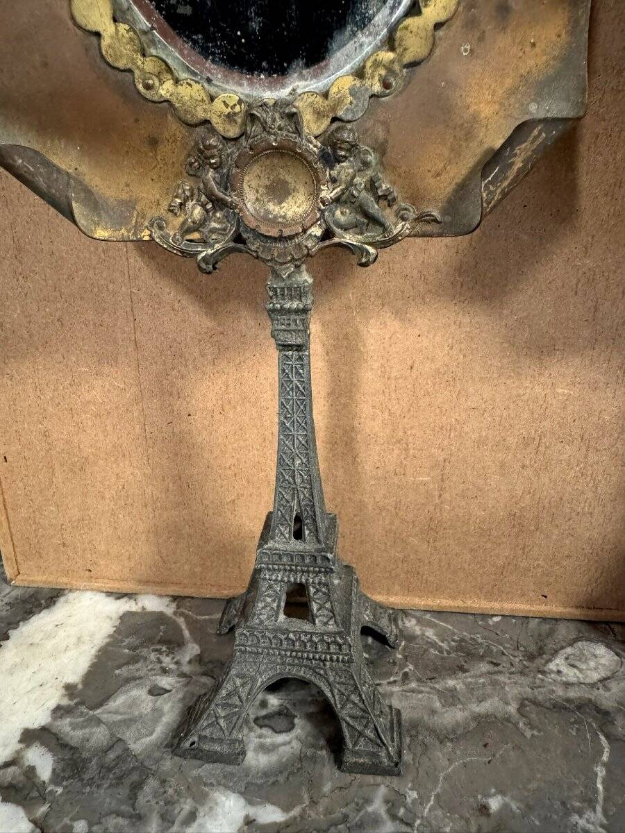 Pair of brass mirrors from the Art Deco period perched on the Eiffel Tower.