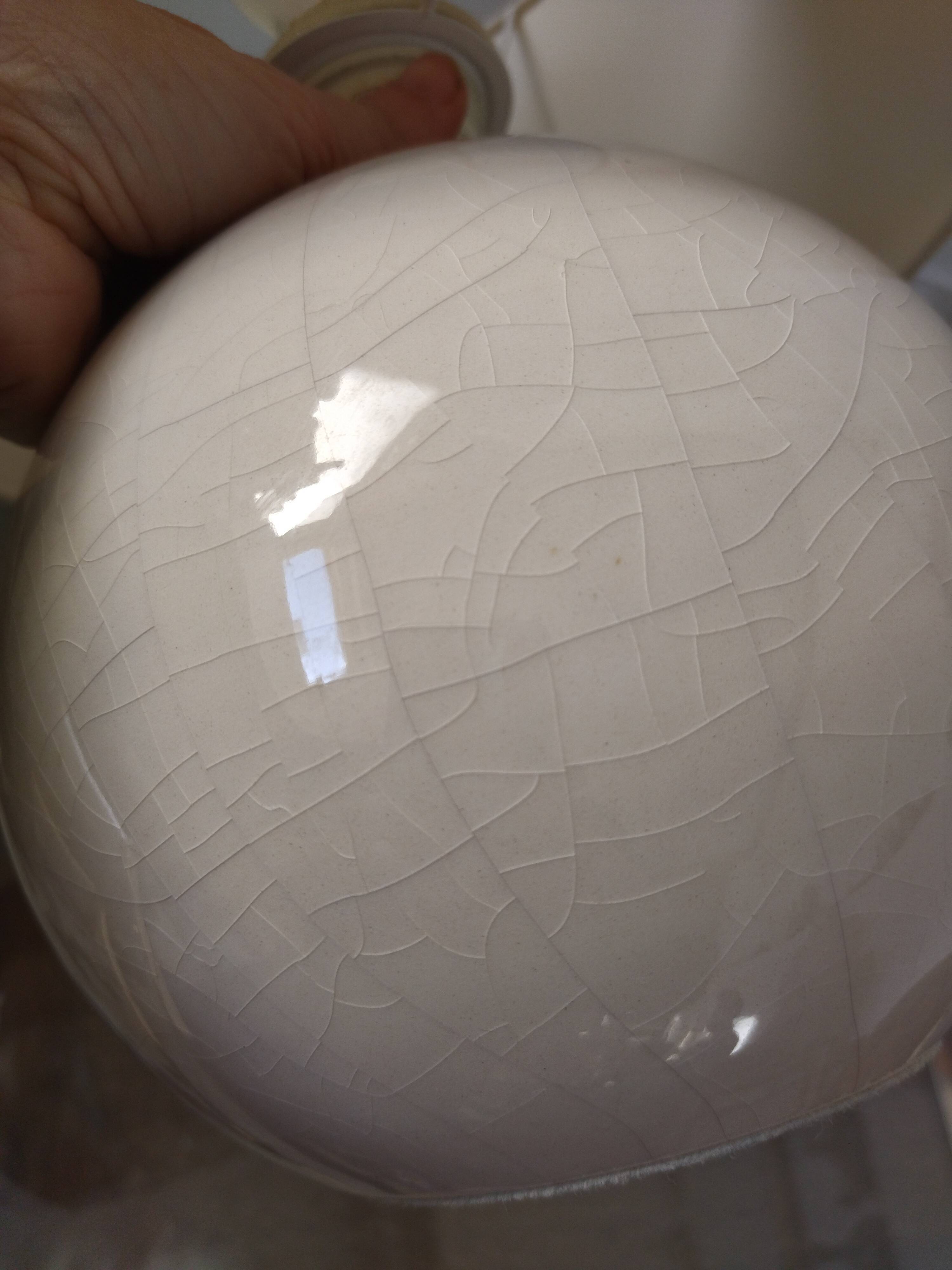 Pair of cracked white Kostka lamps