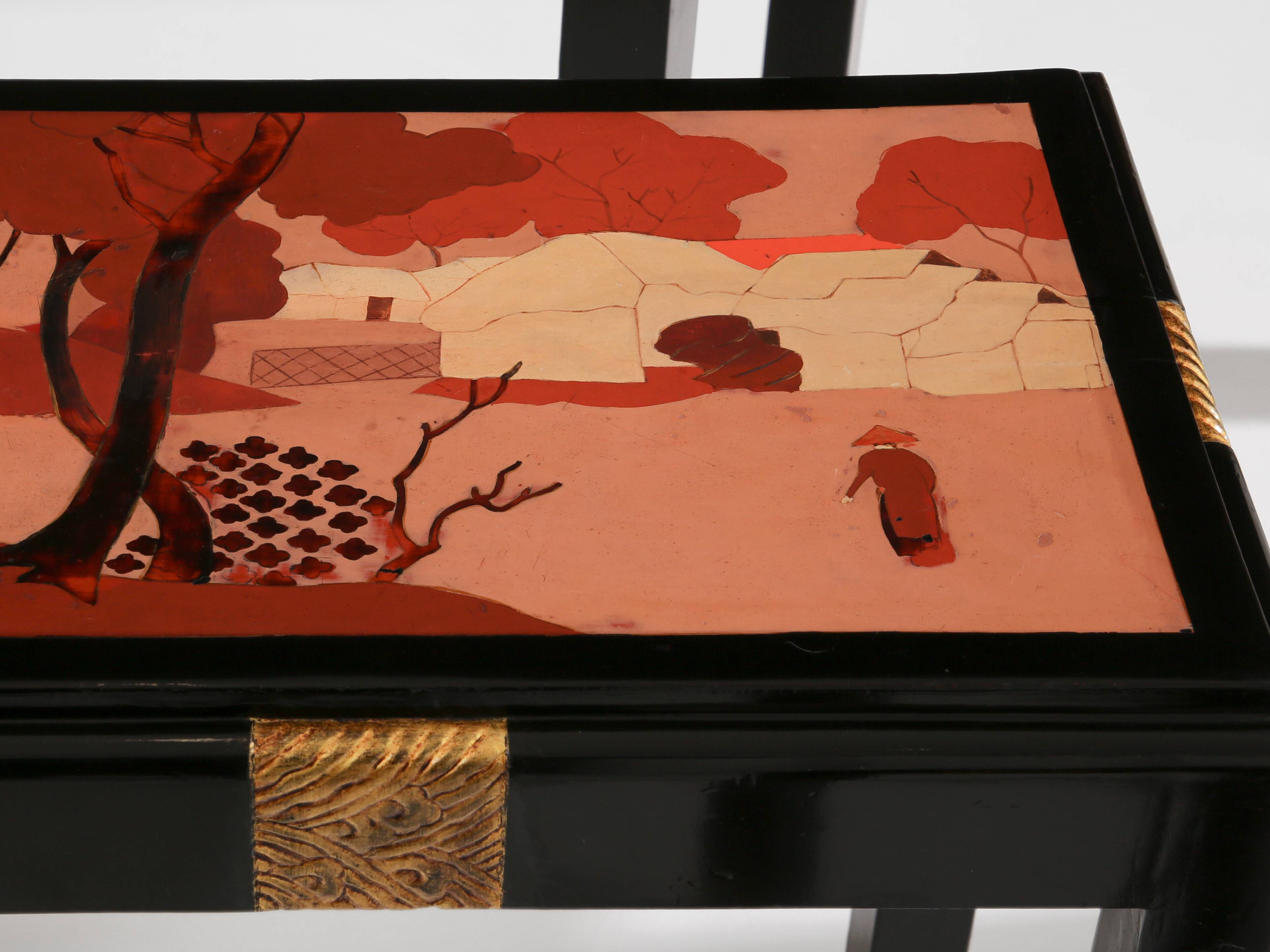 Set of three nesting tables with Asian decor, blackened wood, circa 1920.