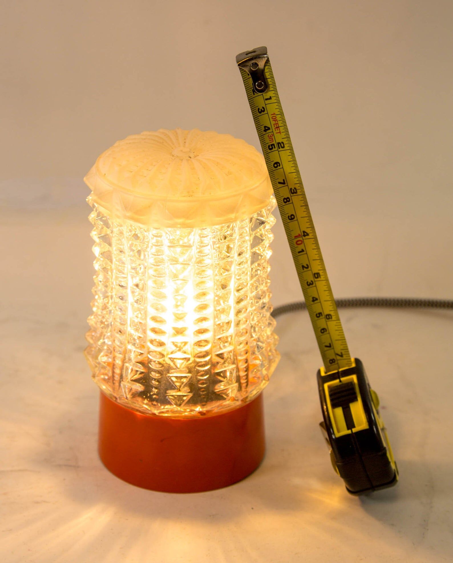 Built-in glass dome and vintage round orange base from the 70s