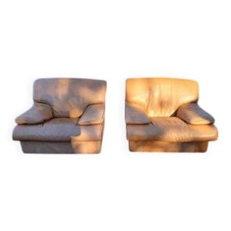 Pair of vintage armchairs in light brown faux leather.
