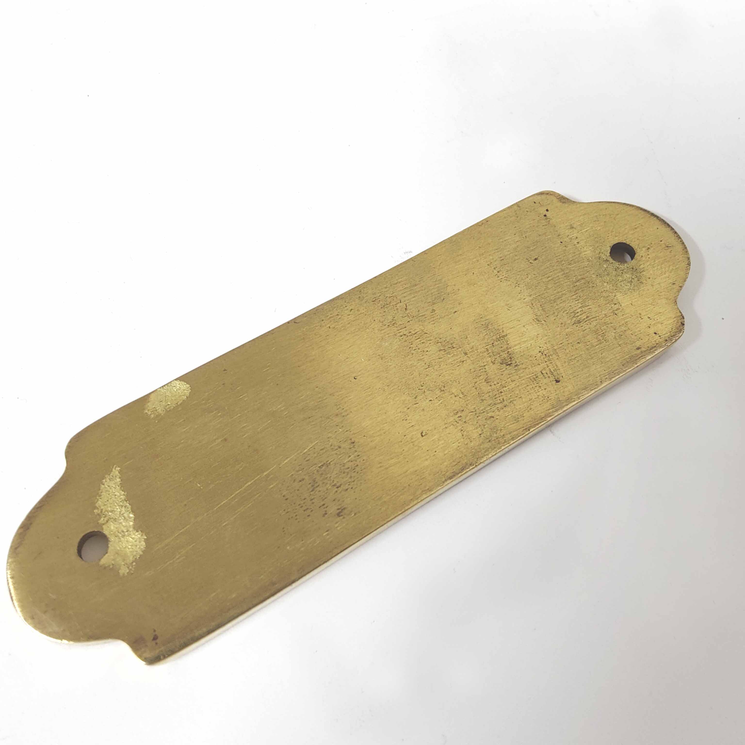 Brass bathroom door plate